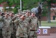 Soldiers in formation render a salute