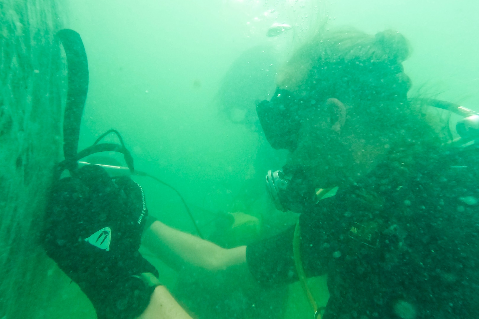 U.K. Royal Navy Diving and Threat Exploitation Group, Delta Diving Unit One Lt. Ali Aindow participates in the underwater portion of the maritime post-blast investigation course at Naval Air Station Key West, June 2-9. The course was developed to expand and develop EOD operator’s skillset in maritime post-blast exploitation techniques through classroom coursework, diving and strategic case study analysis. (U.S. Navy photo)