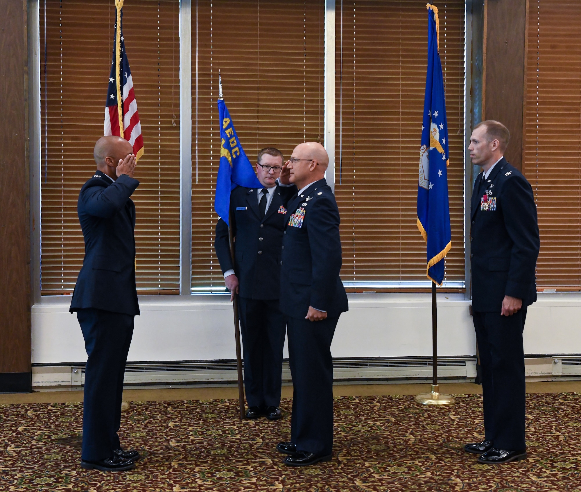 Lt. Col. Eric Withrow, center, salutes Col. Randel Gordon, Arnold Engineering Development Complex, after accepting leadership of the Test Support Division during a change of leadership ceremony at Arnold Air Force Base, Tenn., June 2, 2023. Also pictured is Col. R. Chris Lance, who relinquished leadership of the division during the ceremony, and Master Sgt. Paul Brotherton, guidon-bearer. (U.S. Air Force photo by Jill Pickett)