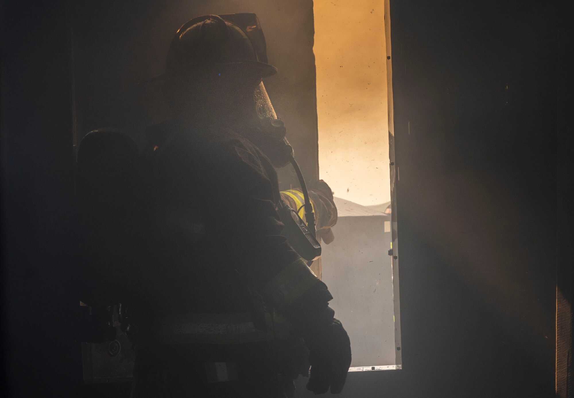 Mr. Michael Braach, 28th Civil Engineer Squadron fireman, opens a window during a structural fire exercise at Ellsworth Air Force Base, South Dakota, June 13, 2023.