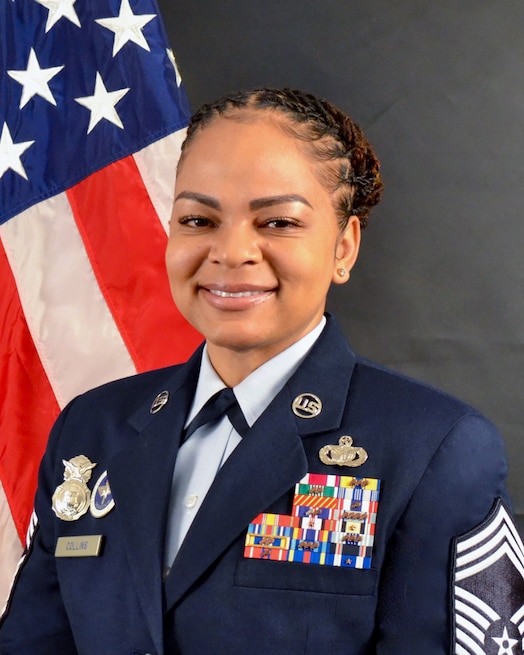  U.S. Air Force Chief Master Sgt. Brandy Collins, 821st Security Forces Squadron Senior Enlisted Leader poses for an official photo. Collins advises the Defense Forces Commander on matters concerning enlisted health, morale, welfare, readiness, career progression and the effective utilization of 65 Defenders in the Department of Defense's northernmost installation and the Department of the Air Force's largest overseas location. (Courtesy photo)
