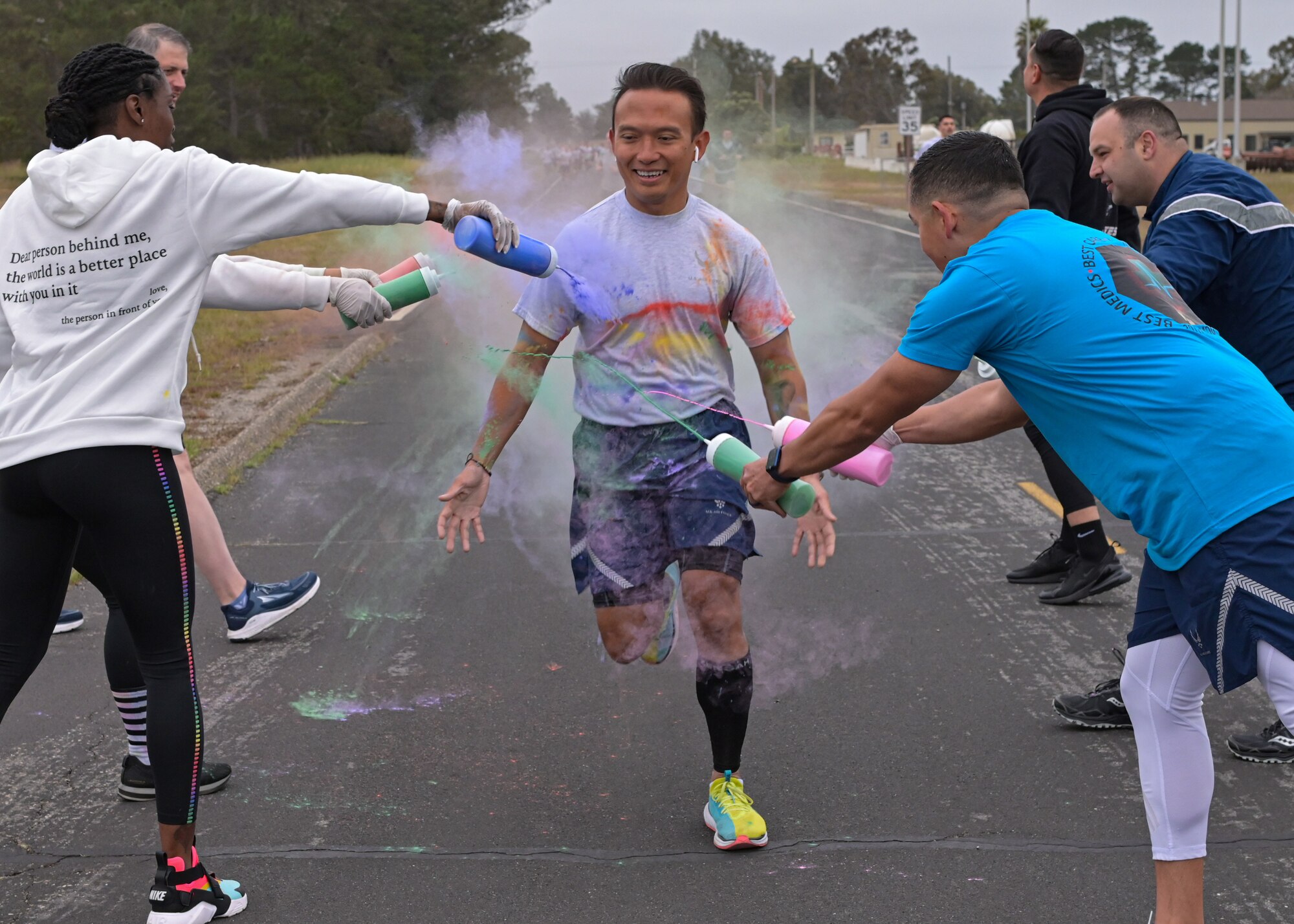 Space Launch Delta 30 members participate in a color run at Vandenberg Space Force Base, Calif., June 2, 2023. During Pride Month, the Department of Defense honors the service, commitment, and sacrifice of the LGBTQ+ Service members and personnel who volunteer to defend our country. (U.S. Space Force photo by Senior Airman Rocio Romo)