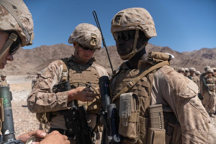 U.S. Marine Corps 2nd Lt. Nkundimana Claude, a fire team leader assigned to Alpha Company, 1st Battalion, 23rd Marine Regiment, 4th Marine Division, is pinned as a 2nd Lt. during his commissioning ceremony at the Marine Corps Air-Ground Combat Center Twentynine Palms, California, June 17, 2023. Claude moved to the United States from Democratic Republic of Congo, Africa and enlisted in the Marine Corps to become a U.S. citizen. He then graduated from Texas State University and commissioned as an officer.