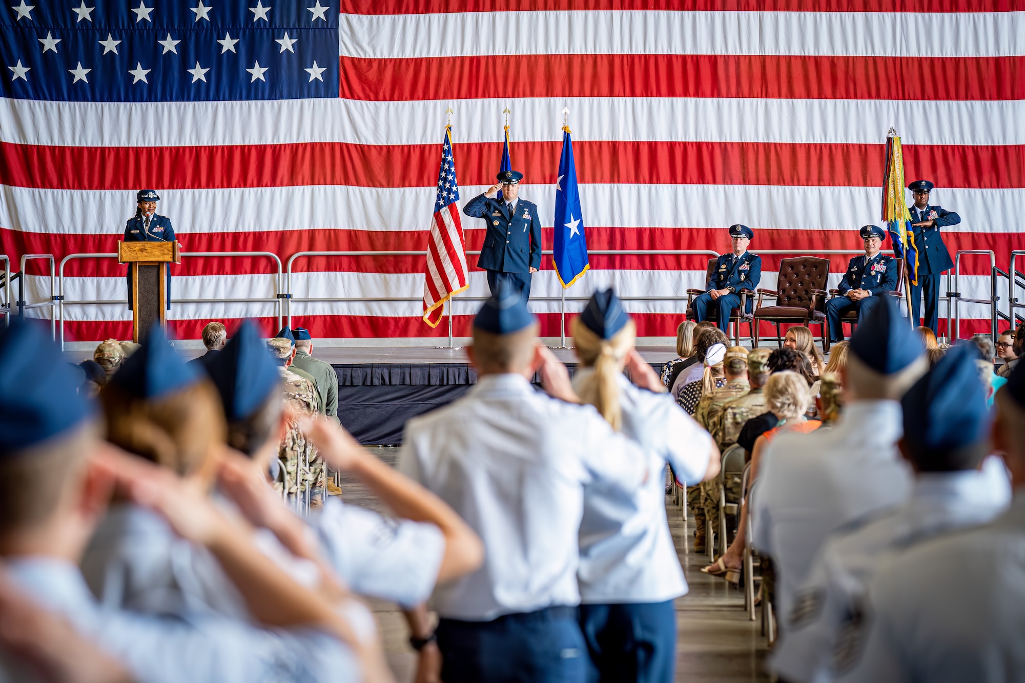 Col. Michael Power renders his first salute to members of Team Kirtland.