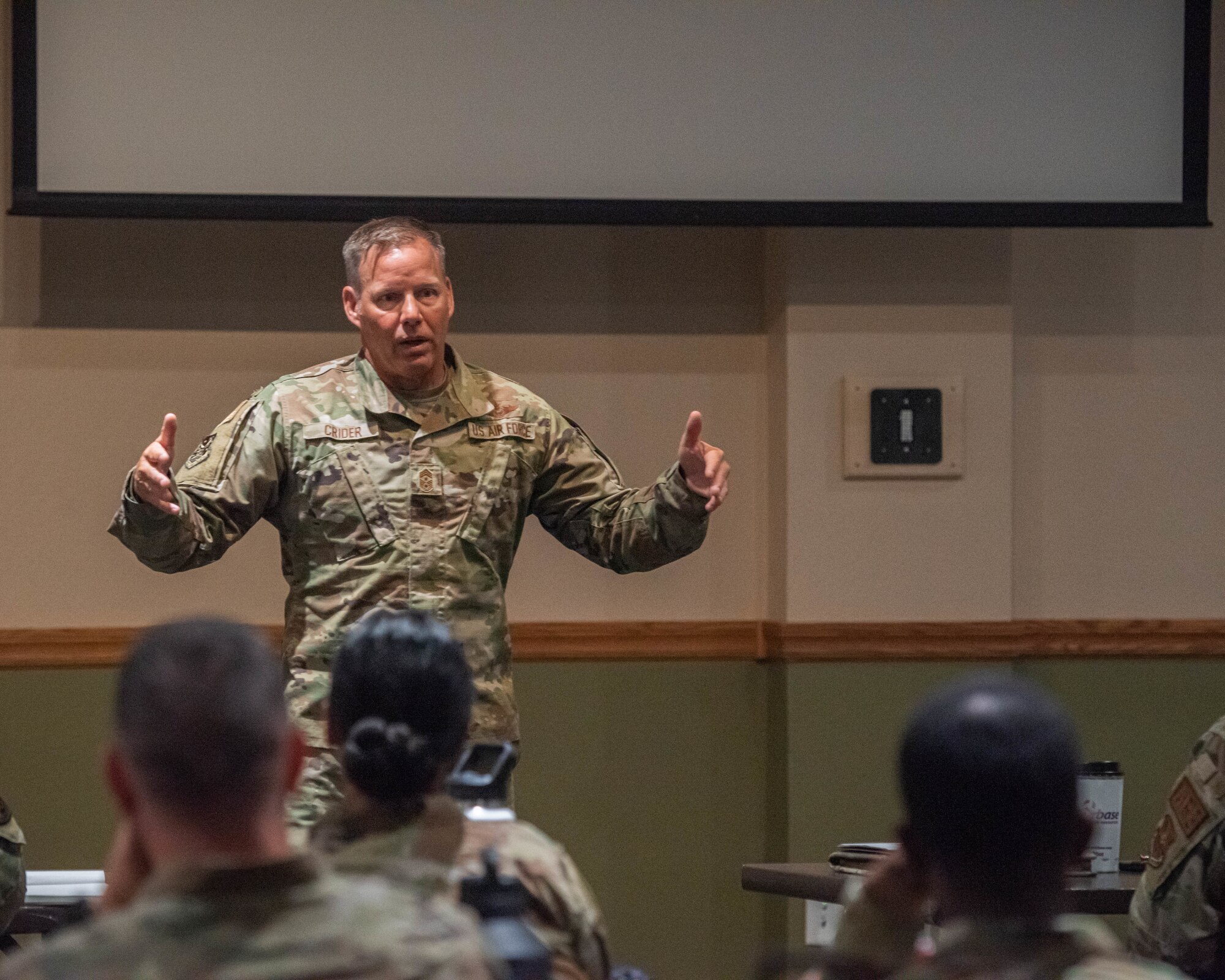 Chief Master Sgt. Ernest Crider, 91st Missile Wing command chief, delivers a speech at the First Sergeant Symposium at Minot Air Force Base, North Dakota, June 13, 2023. Crider emphasized the importance of emotional intelligence to effectively perform as a first sergeant. (U.S. Air Force photo by Airman 1st Class Kyle Wilson)