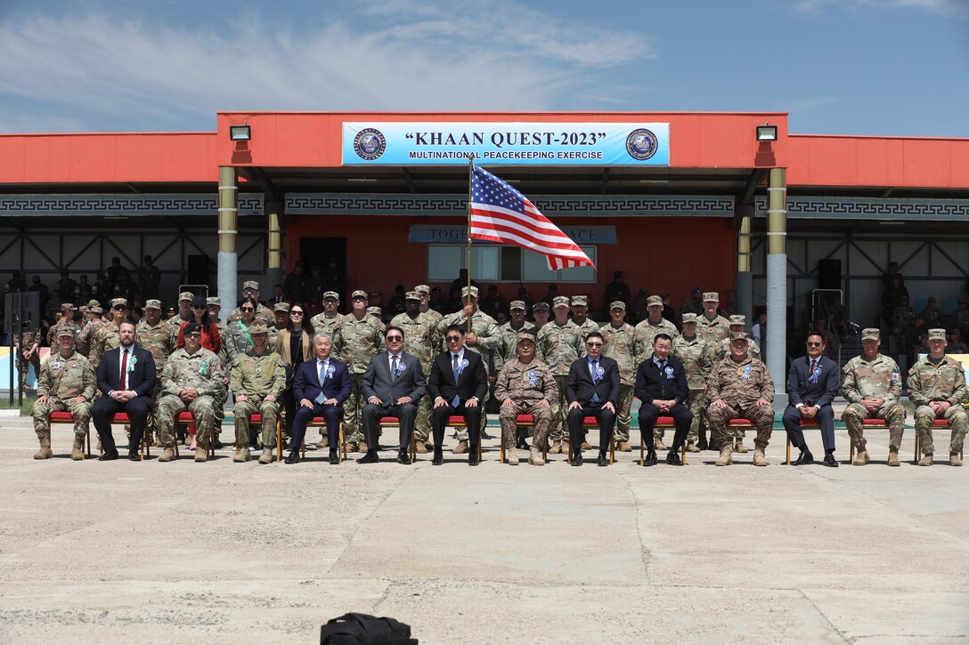 Soldiers from the U.S. Army Pacific (USARPAC) 8th Military Police Brigade, and Soldiers from Alpha Company, 70th Brigade Engineer Battalion, 11th Airborne Division, pose for a group photo with the President of Mongolia, Mr. Ukhnaagiin Khürelsükh, and Mongolian delegates during the opening ceremony of the exercise Khaan Quest 23, 19 June 2023,