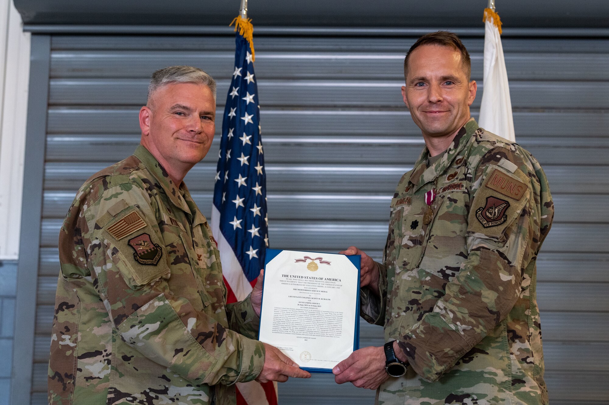 Photo of airmen and leadership at a change of command ceremony.