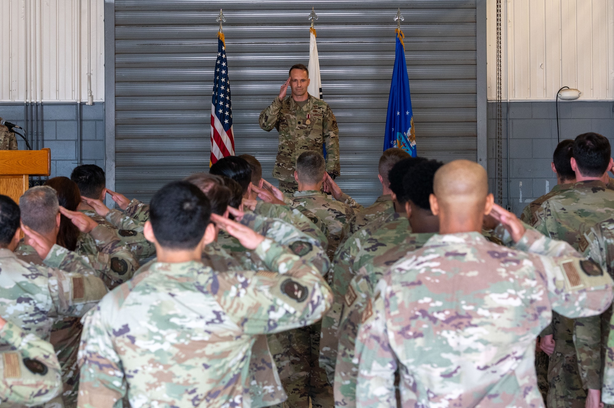 Photo of airmen and leadership at a change of command ceremony.