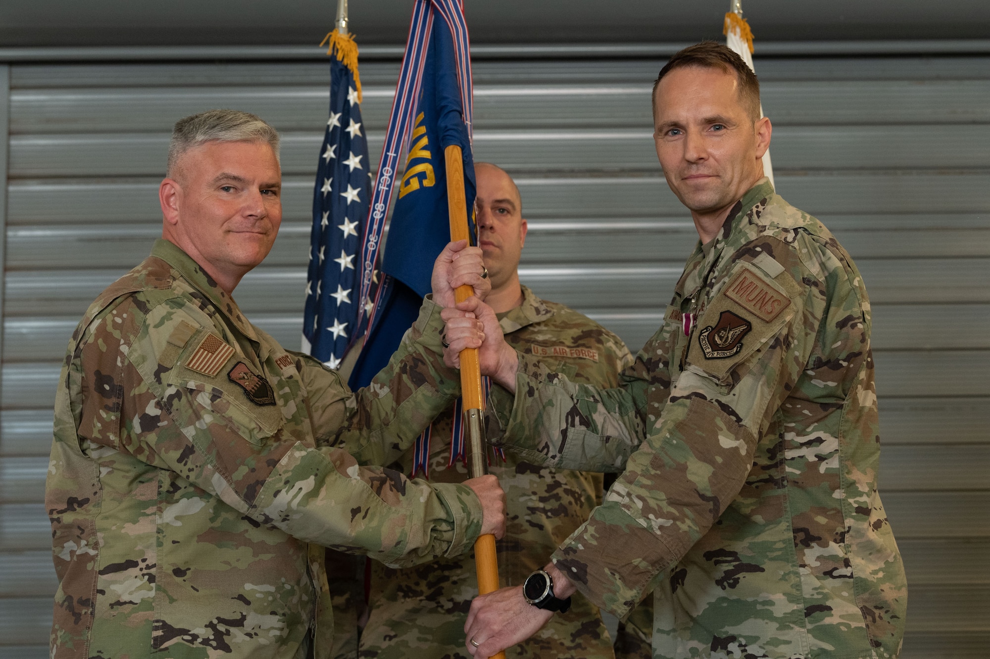 Photo of airmen and leadership at a change of command ceremony.