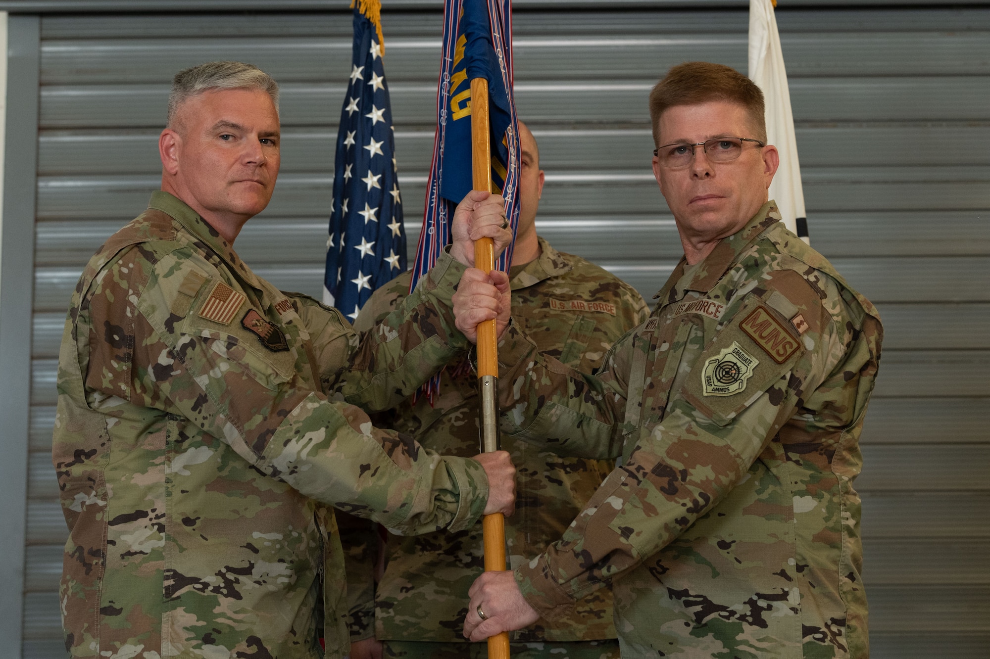 Photo of airmen and leadership at a change of command ceremony.