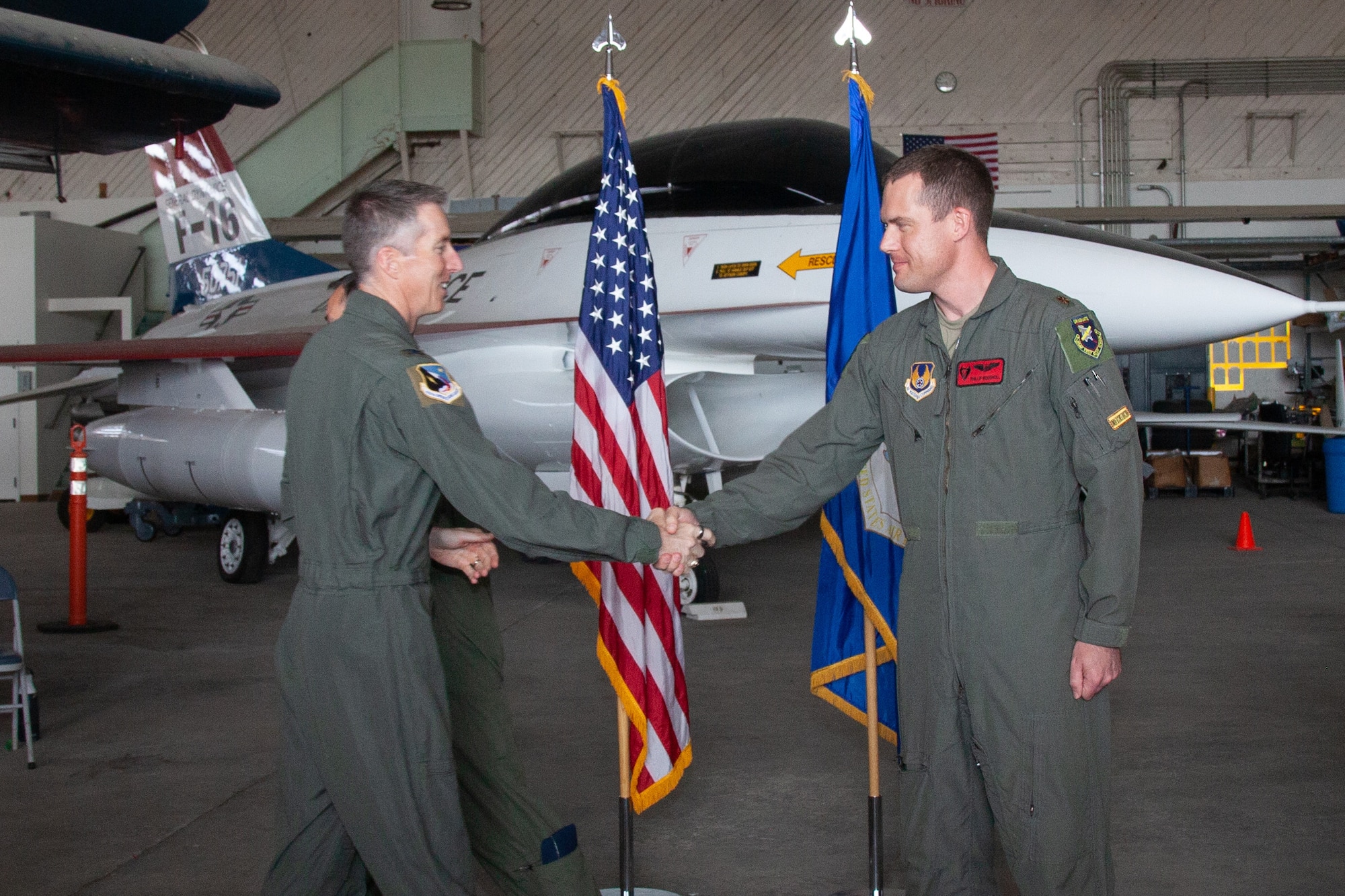 Col. Grant Mizell, 412th Operations Group Commander, congratulates Maj. Phillip Woodhull, the incoming Emerging Technologies Combined Test Force Director, following the ET-CTF’s change of command ceremony on Edwards Air Force (Air Force photo by Carla Escamilla)