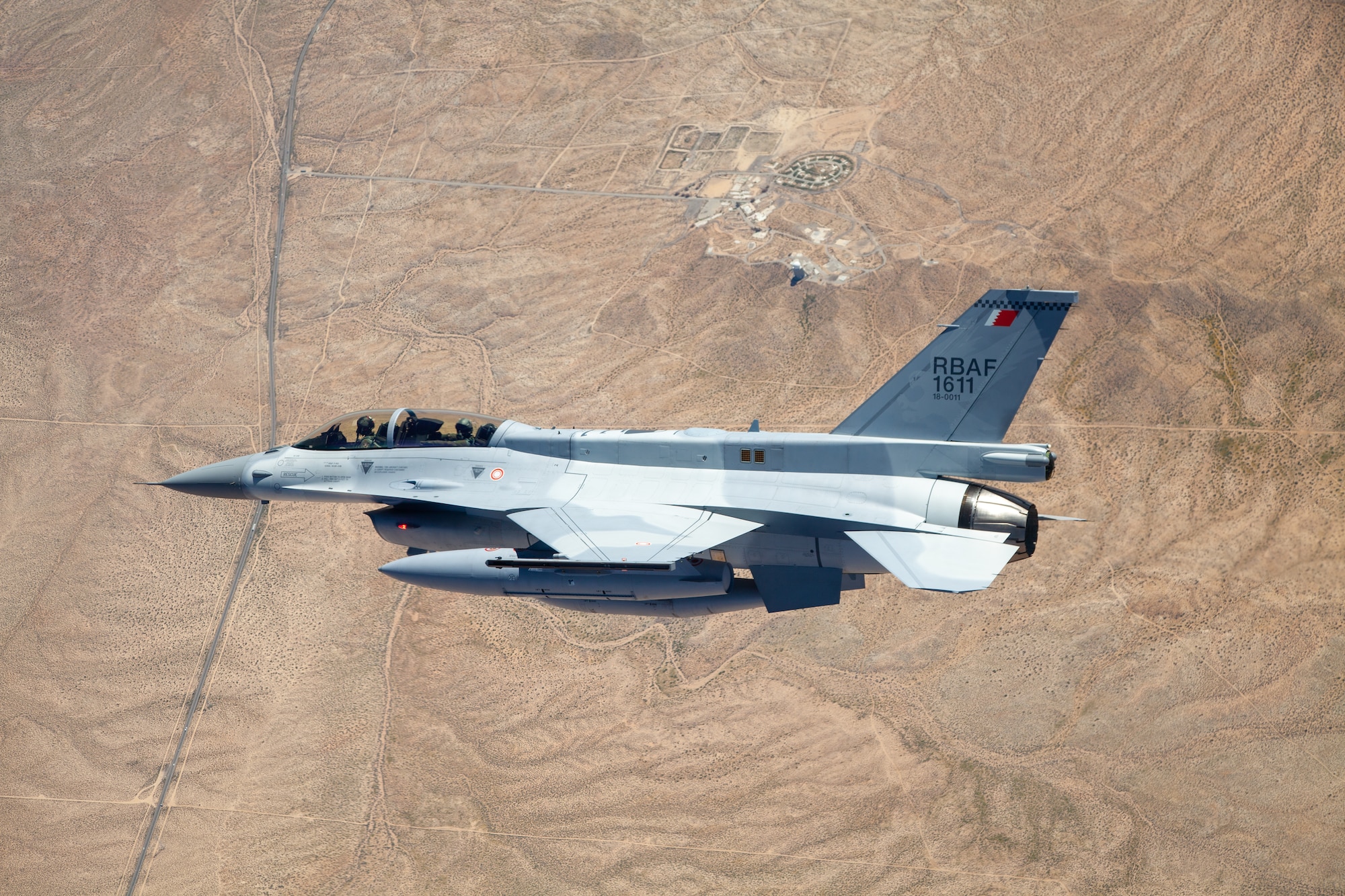 An F-16 Block 70 aircraft flies in the skies above Edwards Air Force Base, California, March 28, 2023. The newest variant of the fighter jet is being tested by the newly-renamed Airpower Foundations Combined Test Force at Edwards AFB. (Air Force photo by Christian Turner)