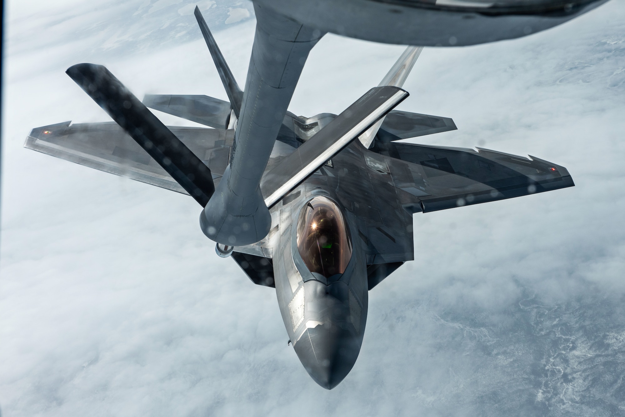 A U.S. Air Force KC-135 Stratotanker from Fairchild Air Force Base, Washington, refuels an F-22 Raptor from Joint Base Elmendorf-Richardson, Alaska, during Northern Edge 23-1, May 10, 2023. NE 23-1 provides the opportunity for U.S. military personnel to sharpen their skills; to practice tactics, techniques, and procedures; to improve command, control and communication relationships; and to develop cooperative plans and programs.(U.S. Air Force photo by 2nd Lt. Ariana Wilkinson)