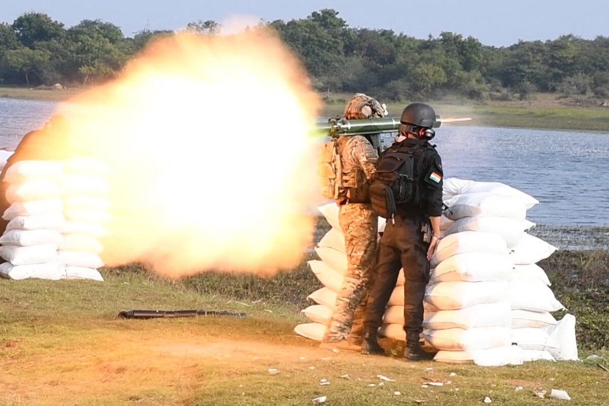 A soldier shoots a weapon.