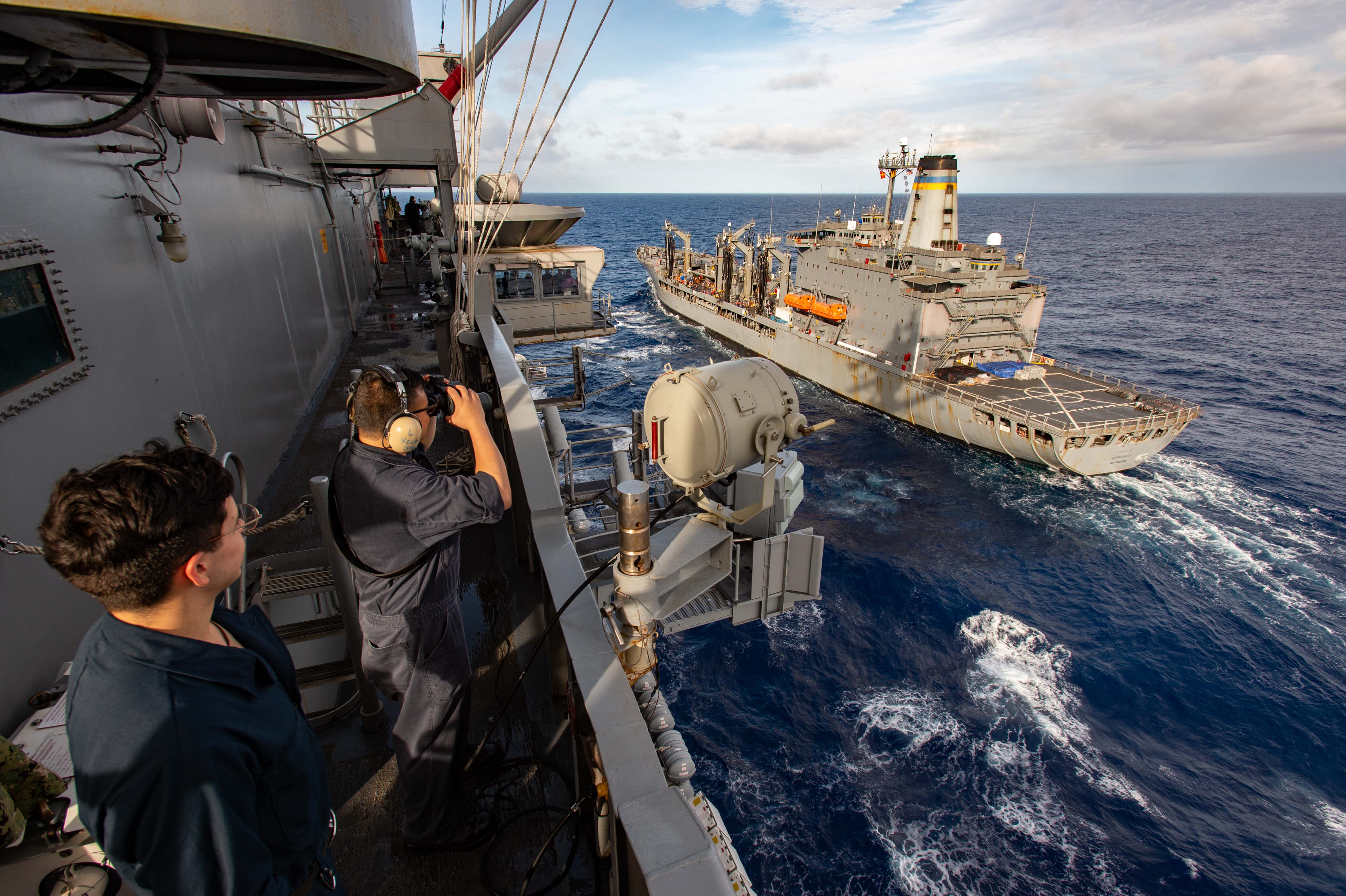 USS Ronald Reagan (CVN 76) comes alongside USNS Rappahannock (T-AO 204) in the Philippine Sea.