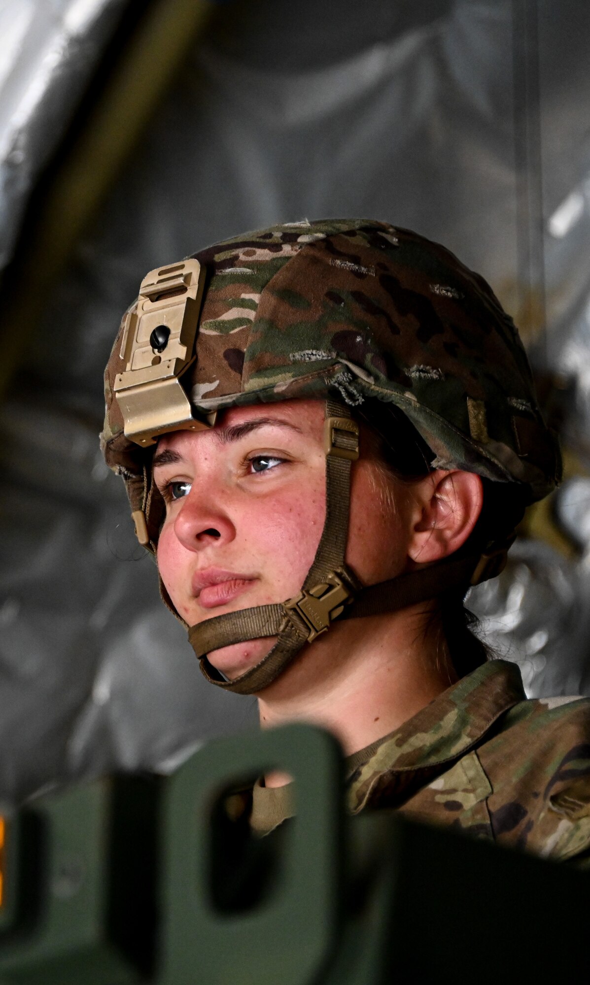 A Soldier stands in a M142 High Mobility Artillery Rocket System while offloading from a C-17 Globemaster III at Fort Smith, Arkansas, June 14, 2023. The M142 High Mobility Artillery Rocket System is manned by Soldiers in order to support joint early and forced entry expeditionary operations with high-volume destructive, suppressive, and counter-battery fires. (U.S. Air Force photo by Senior Airman Kayla Christenson)