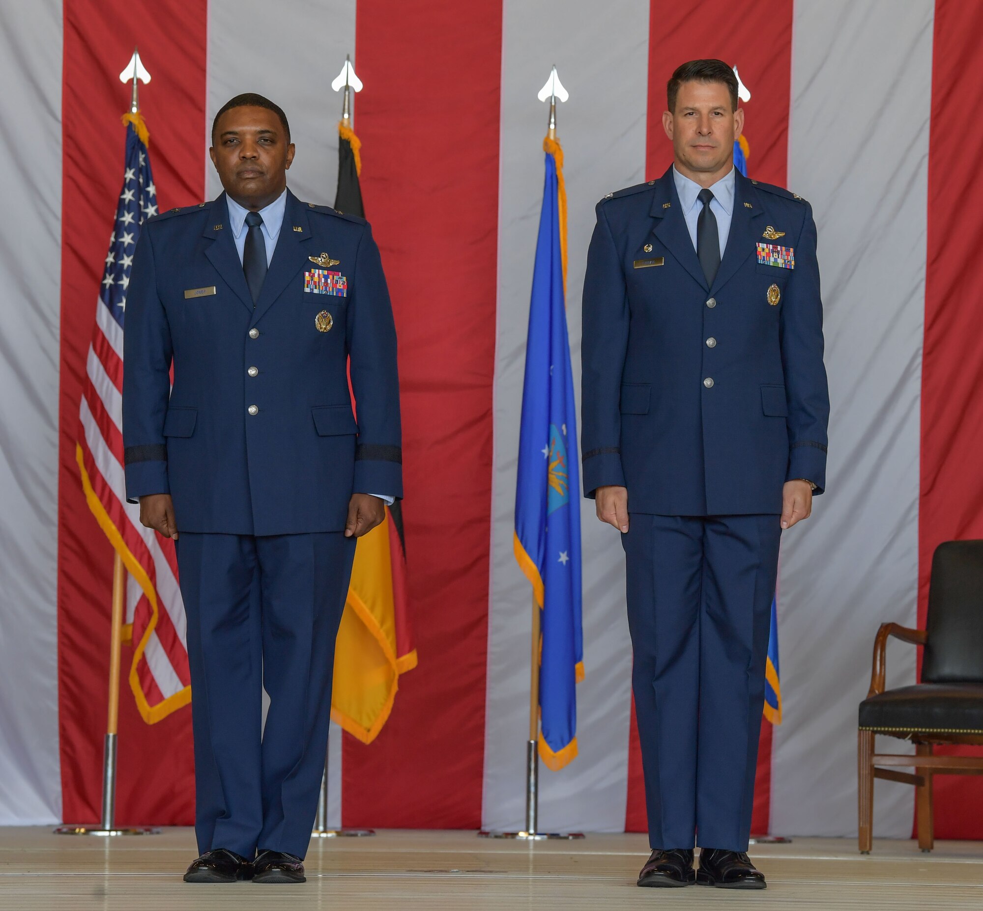 U.S. Air Force Brig. Gen. Otis C. Jones, 86th Airlift Wing commander, left, and Col. Sean Finnan, 86th Operations Group out-going commander, stand at attention during the 86th OG change of command ceremony at Ramstein Air Base, Germany, June 15, 2023. Finnan relinquished command of the 86th OG to Col. Bret Echard. (U.S. Air Force photo by Airman Trevor Calvert)