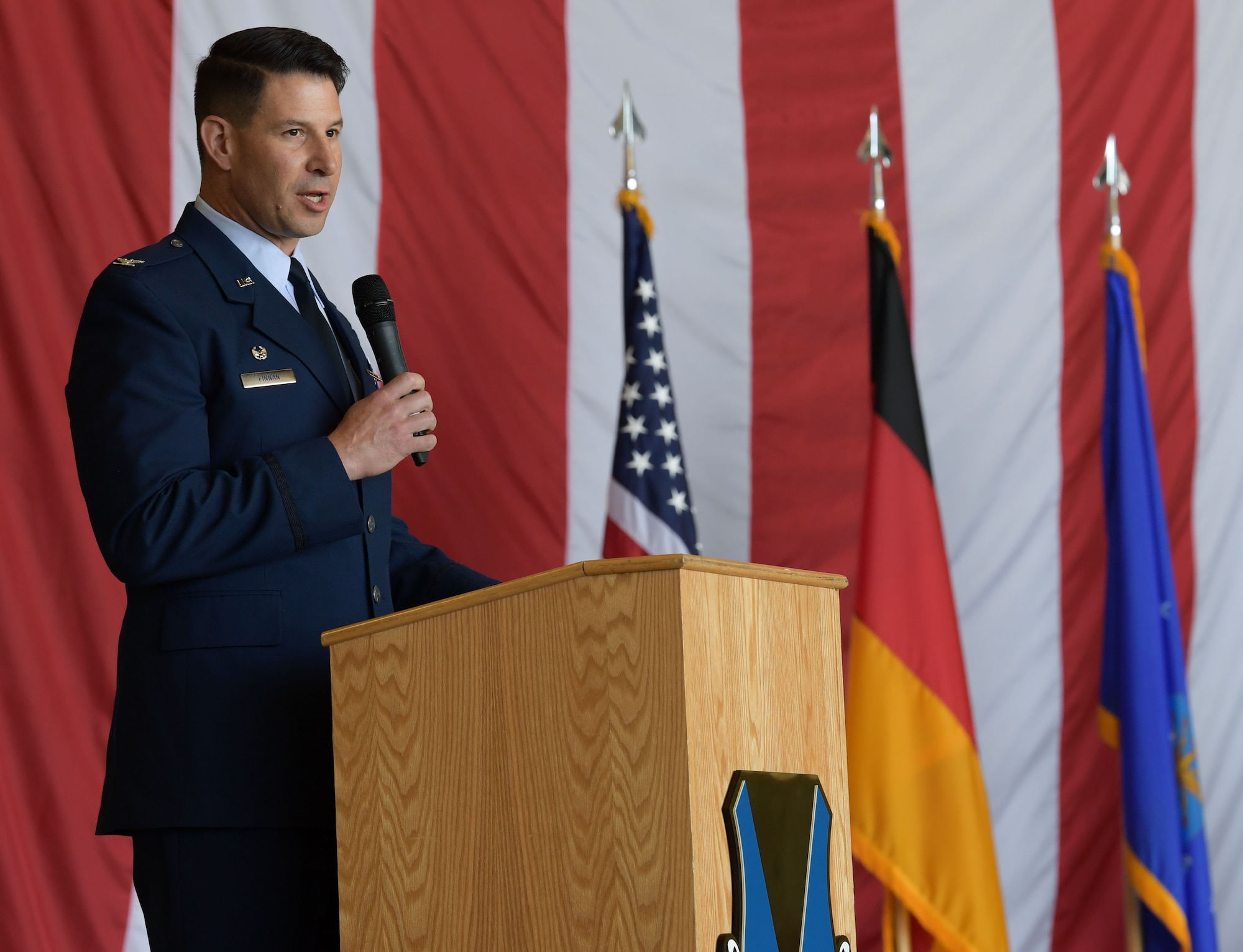 U.S. Air Force Col. Sean Finnan, 86th Operations Group out-going commander, speaks to the audience during the 86th OG change of command ceremony at Ramstein Air Base, Germany, June 15, 2023. The operations group maintains readiness to deploy and employ aerial assets across the spectrum of air combat support missions. (U.S. Air Force photo by Airman Trevor Calvert)