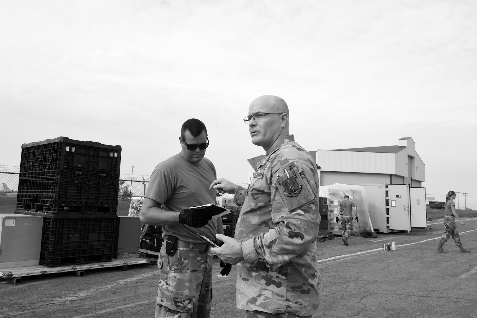 Capt. Michael Wollenzien, a deployment commander with the Florida Air National Guard’s 114th Electromagnetic Warfare Squadron, provides guidance to an Airman during Exercise ThunderMoose, June 13, 2023, at Bangor Air National Guard Base in Maine. The exercise involved transporting an electromagnetic warfare system to the base and setting up an operating facility.
