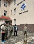 Lt. Col. Eugene Chu, the 405th Army Field Support Brigade’s Corps Logistics Support Element senior representative, briefs representatives from the U.S. Navy and the Defense Logistics Agency outside the V Corps headquarters in Poznan, Poland, June 21. The CLSE serves as a strategic liaison among the U.S. Army Materiel Command enterprise, Department of Defense agencies, the 405th AFSB and V Corps. (U.S. Army courtesy photo)