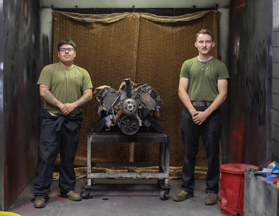 U.S. Marine Corps Lance Cpl. Emilio Cervantes, left, an automotive maintenance technician, and Lance Cpl. Jesse Attanasio, a light armored vehicle repairman, both with 2nd Maintenance Battalion, 2nd Marine Logistics Group pose for a photo on Camp Lejeune, North Carolina, June 13, 2023. Marines with 2nd Maintenance Battalion provide intermediate-level maintenance for the II Marine Expeditionary Force's tactical ordnance, engineer, motor transport, communications electronics and general support ground equipment. (U.S. Marine Corps photo by Sgt. Scott Jenkins)