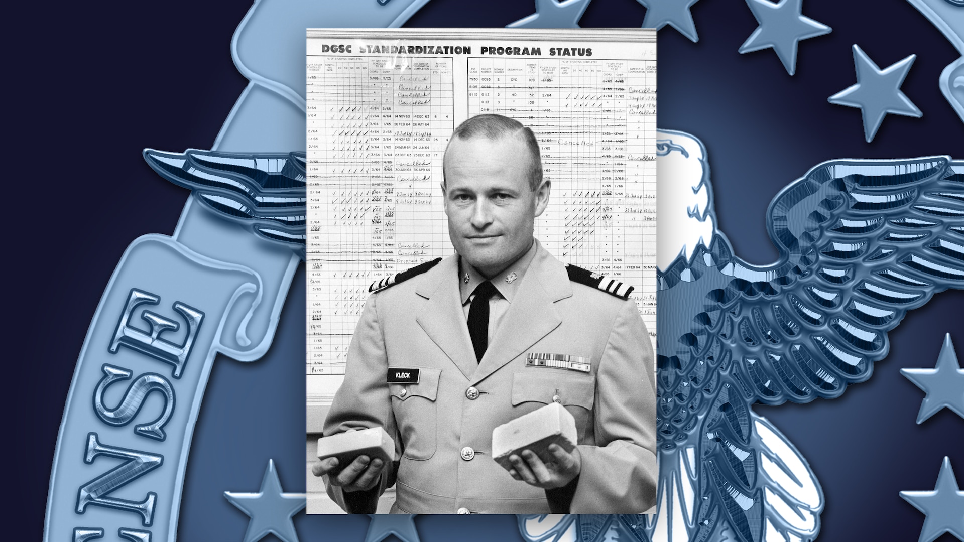Black and white image of man holding bars of soup in both hands.