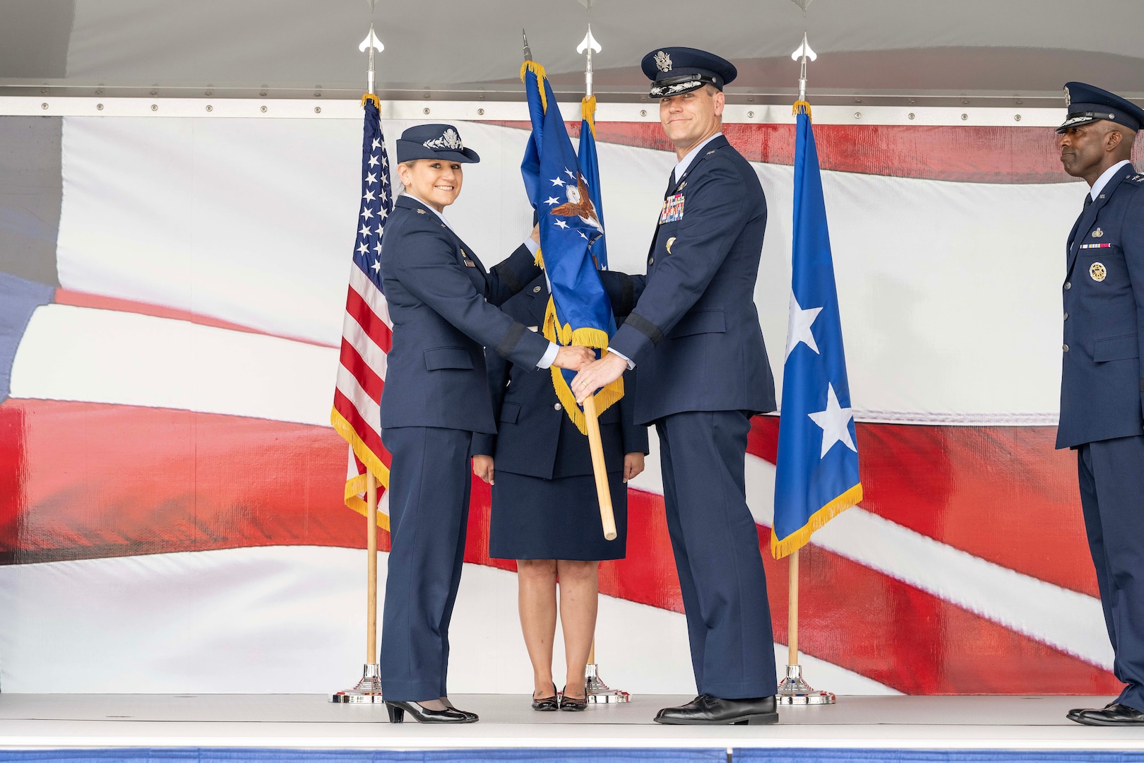U.S. Air Force Brig. Gen. Jefferson J. O’Donnell, right, receives the Air Force Personnel Center’s flag from Lt. Gen. Caroline M. Miller, Deputy Chief of Staff for Manpower, Personnel and Services, Headquarters U.S. Air Force, during the AFPC change of command ceremony June 20 at Joint Base San Antonio-Randolph, Texas. Prior to taking command of AFPC, O’Donnell served as the Director of Regional Affairs for the Deputy Under Secretary of the Air Force, International Affairs.