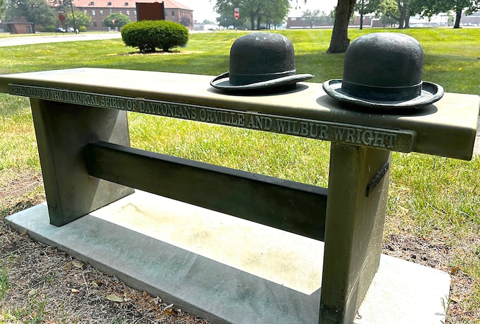 A tribute to the Wright brothers is located on a bench leading up to the front door of the Arnold House.