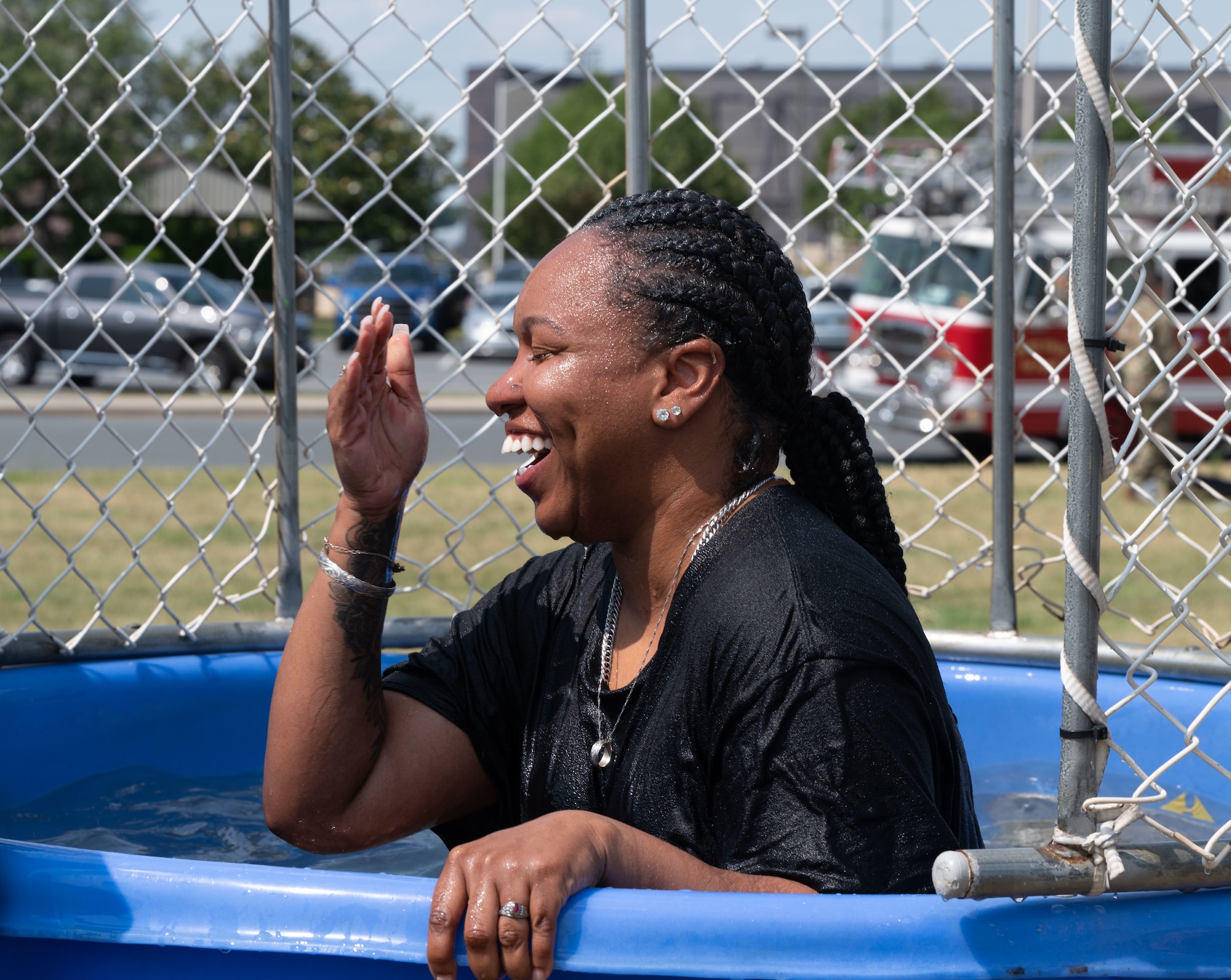 Tech. Sgt. Chelsea Johnson, 436th Force Support non-commissioned officer in charge of installation personnel readiness, rises from a dunk tank during a Juneteenth block party at Dover Air Force Base, Delaware, June 15, 2023. In 2021, U.S. President Joe Biden signed the Juneteenth National Independence Day Act establishing June 19th as a federal holiday. (U.S. Air Force photo by Airman 1st Class Dieondiere Jefferies)