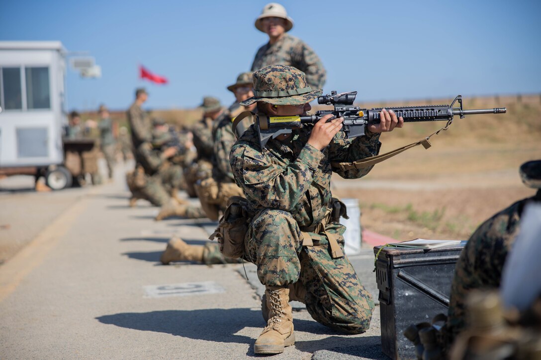 A U.S. Marine Corps recruit with Hotel Company, 2nd Recruit Training Battalion, aims down his sights during the table one course of fire at Marine Corps Base Camp Pendleton, Calif., June 20, 2023. Table one covered the basic fundamentals of marksmanship and rifle safety in all shooting positions sitting, kneeling, and prone. (U.S. Marine Corps photo by Lance Cpl. Alvarez)