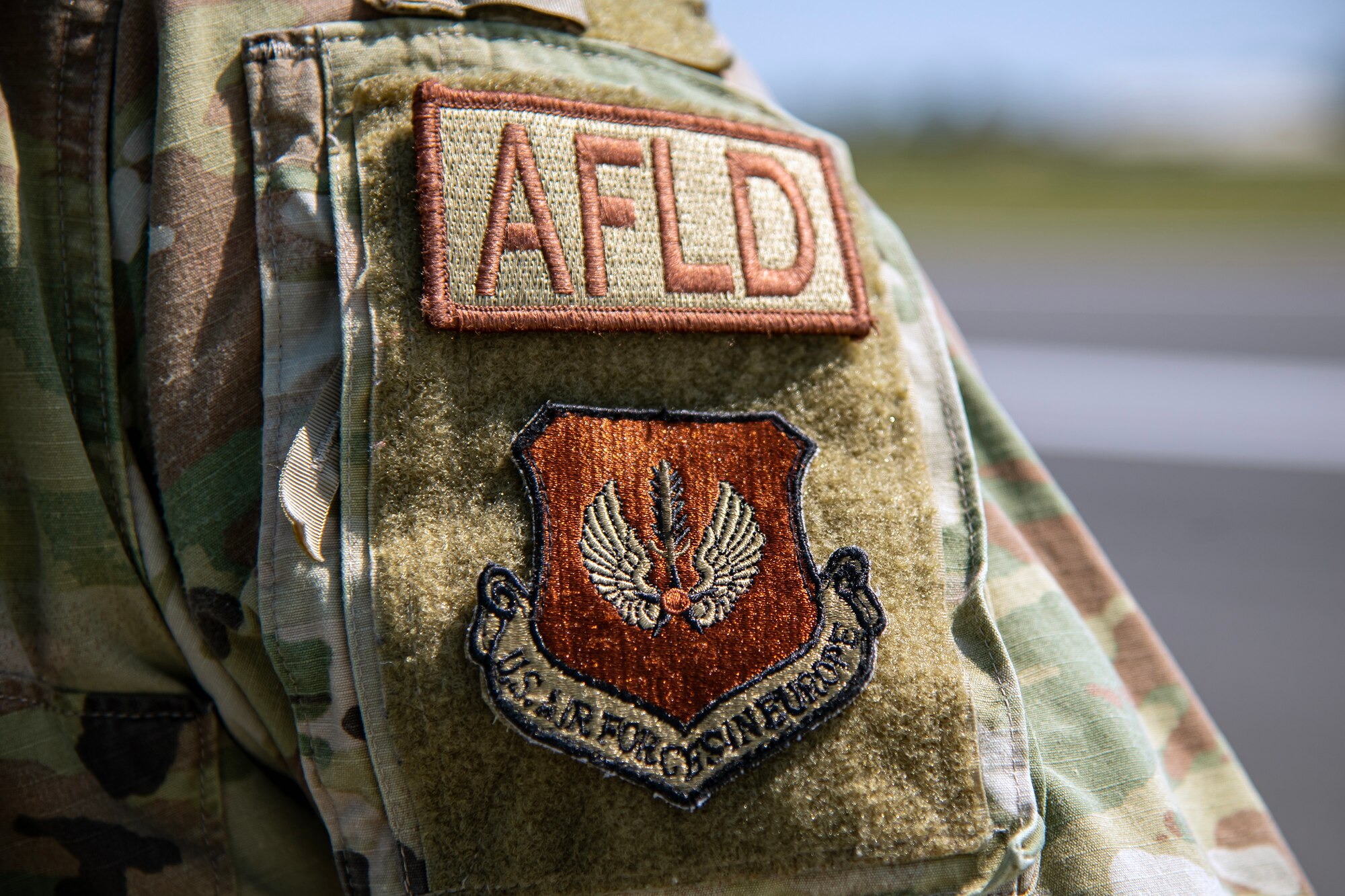 U.S. Air Force Senior Airman Daniel Ybarra, 420th Operations Squadron airfield management shift lead, stands on the flightline at RAF Fairford, England, June 14,2023. Ybarra along with multiple Airmen deployed to Fairford to support Bomber Task Force 23-3. Ybarra along with multiple Airmen deployed to Fairford to support Bomber Task Force 23-3. Support operations executed by units like Ybarra’s are key in ensuring the U.S. Air Force is postured and ready with a credible force to assure, deter, and defend in an increasingly complex security environment. (U.S. Air Force photo by Staff Sgt. Eugene Oliver)