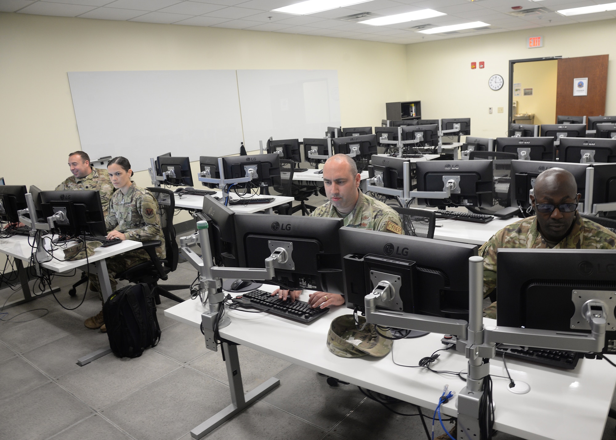 Airmen assigned to the 175th Cyberspace Operations Group work at computer terminals at Martin State Air National Guard Base, Middle River, Maryland on June 20, 2023.