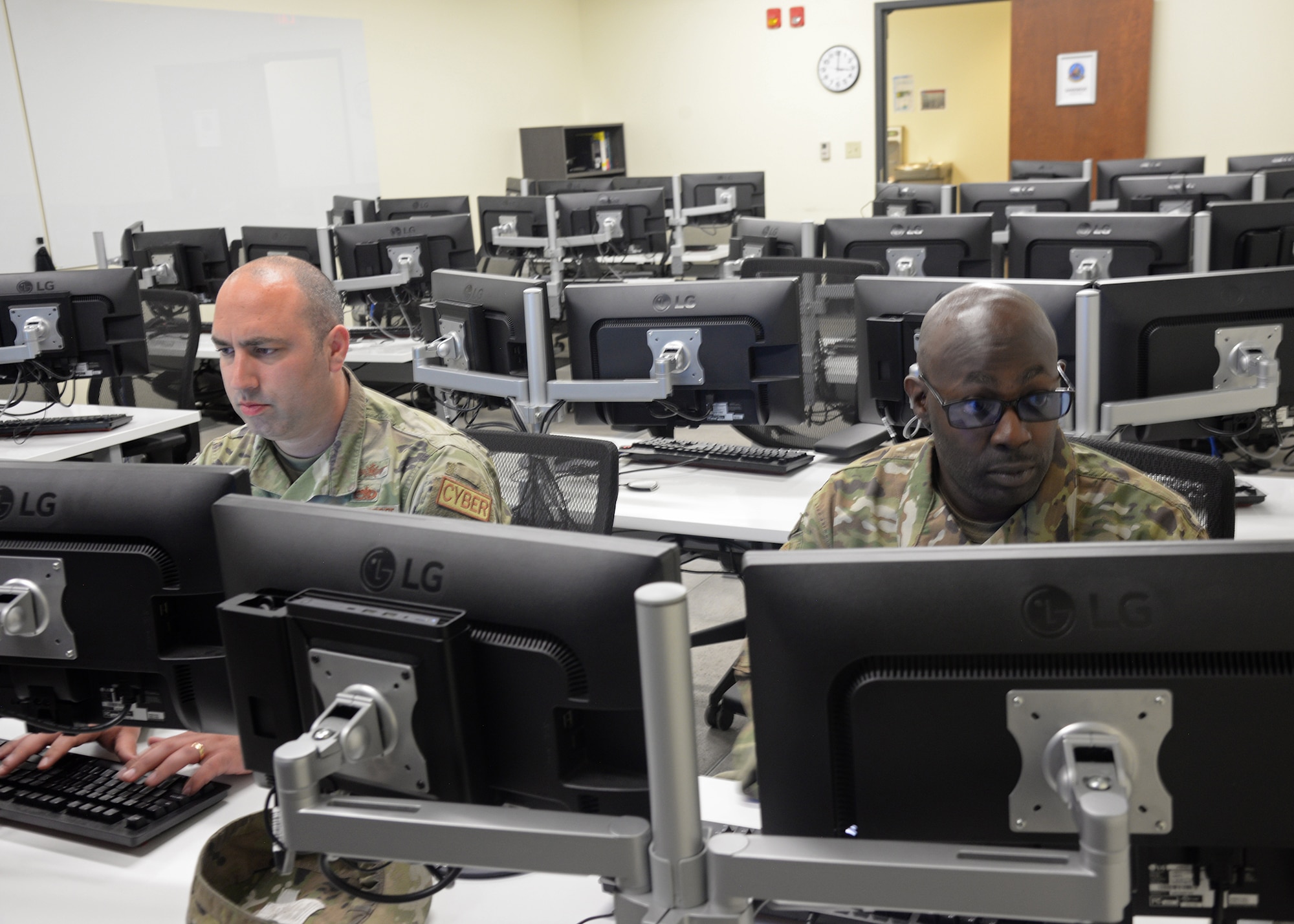 Airmen assigned to the 175th Cyberspace Operations Group work at computer terminals at Martin State Air National Guard Base, Middle River, Maryland on June 20, 2023.