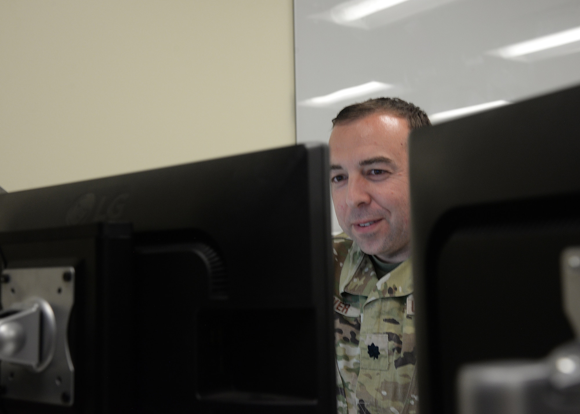 An Airman assigned to the 175th Cyberspace Operations Group works at a computer terminal at Martin State Air National Guard Base, Middle River, Maryland on June 20, 2023.