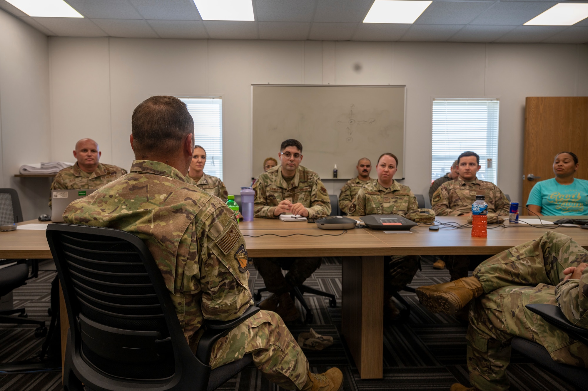 Airmen sit in a classroom
