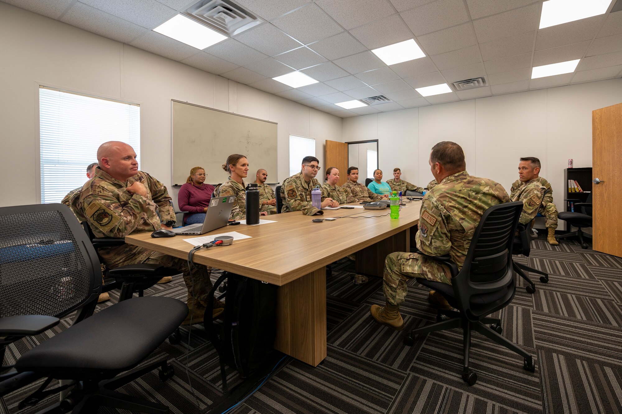 Airmen sit in a classroom