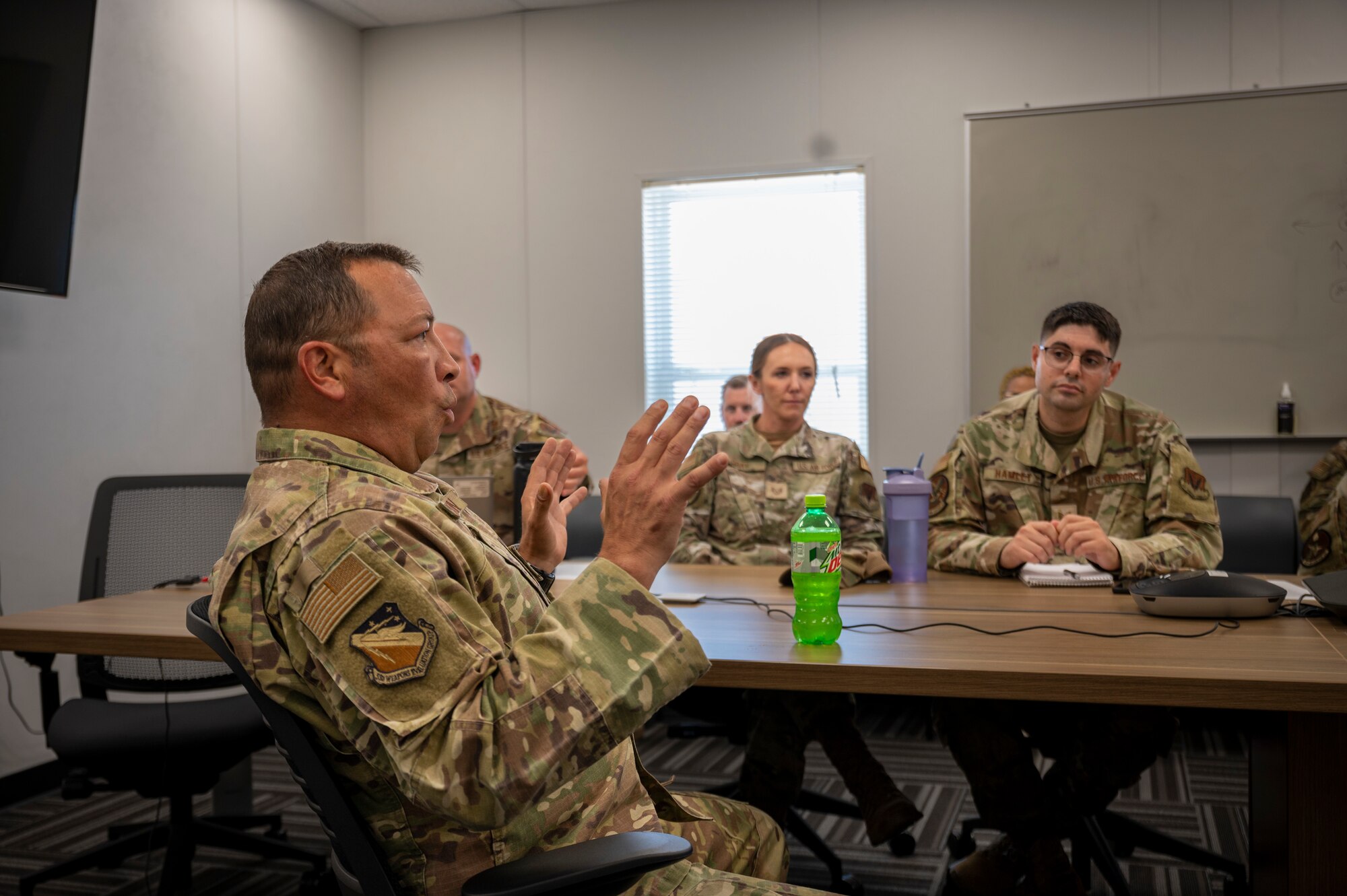 Airmen sit in a classroom