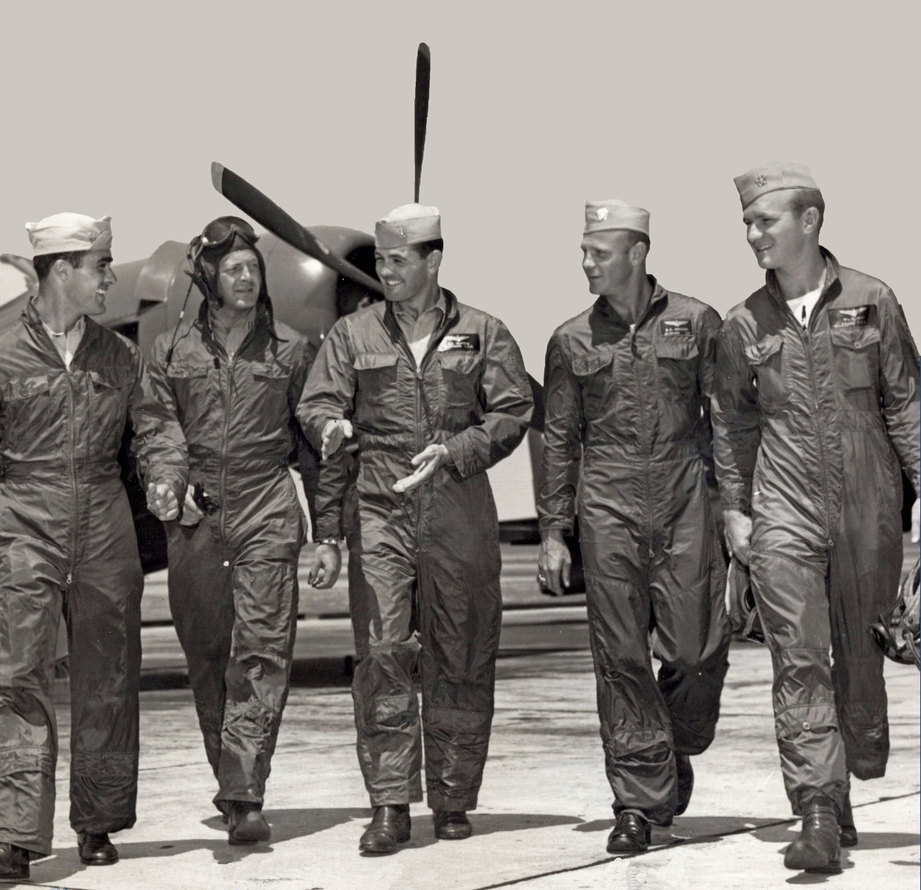 The 1947 team walks the flight line at Floyd Bennett Field, New York. In the background is one of their F8F Bearcats, arguably one of the smallest yet most powerful single piston-engine fighters to ever fly from a U.S. carrier, too late to combat Japanese kamikazes. From left is Lt. Bob Thelen, Lt. Chuck Knight, Lt. Cmdr. Bob Clarke (OINC), Lt. Cmdr. R.E. “Dusty” Rhodes, Lt. jg. Billy May.