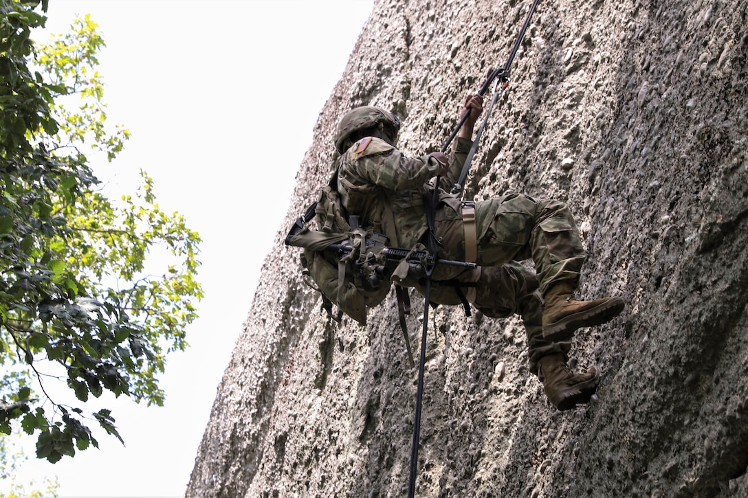 Approximately 25 Soldiers with 1st Squadron, 104th Cavalry Regiment, 2nd Infantry Brigade Combat team, 28th Infantry Division, Pennsylvania Army National Guard, conducted rappel training June 13 at a rock formation near Fort Indiantown Gap known as Boxcar Rocks. The Soldiers used mountain warfare skills to ascend the north face of the Boxcar Rocks safely with harnesses and ropes, then rappelled down the south face approximately 100 feet. (U.S. Army National Guard photo by Sgt. 1st Class Zane Craig)