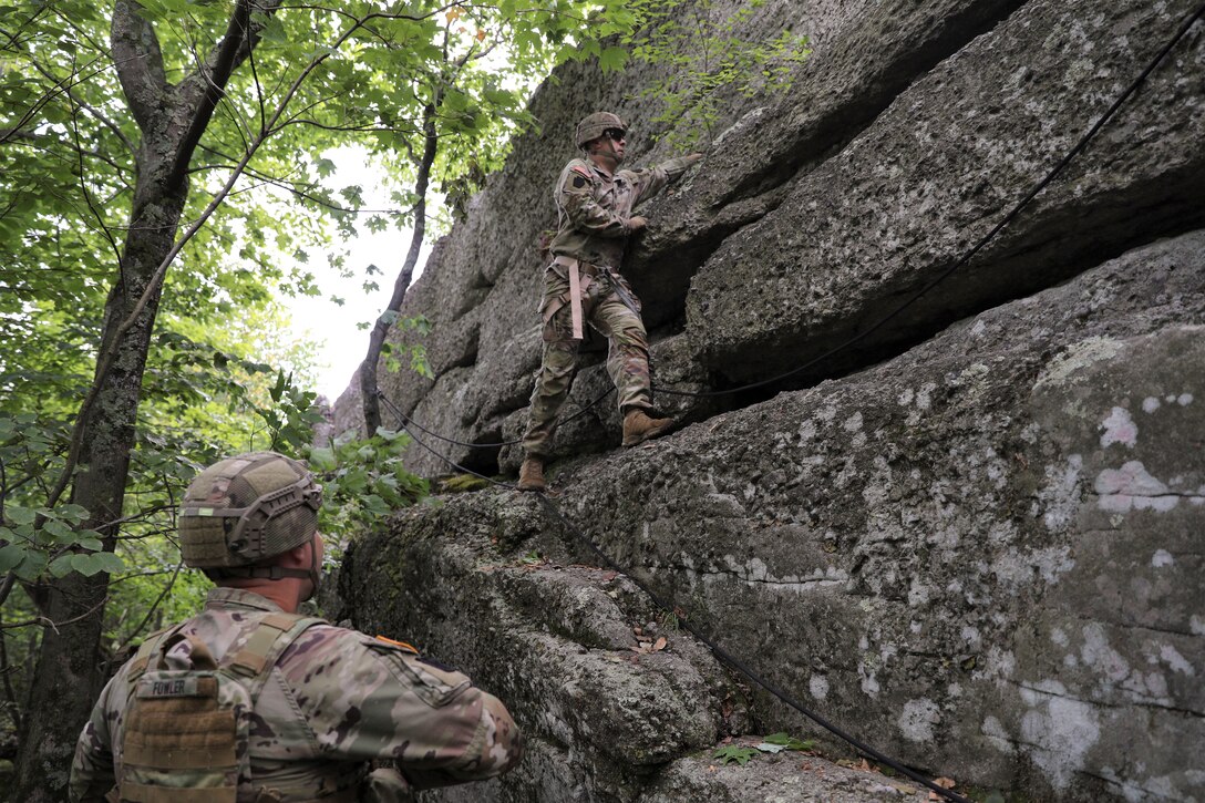 Approximately 25 Soldiers with 1st Squadron, 104th Cavalry Regiment, 2nd Infantry Brigade Combat team, 28th Infantry Division, Pennsylvania Army National Guard, conducted rappel training June 13 at a rock formation near Fort Indiantown Gap known as Boxcar Rocks. The Soldiers used mountain warfare skills to ascend the north face of the Boxcar Rocks safely with harnesses and ropes, then rappelled down the south face approximately 100 feet. (U.S. Army National Guard photo by Sgt. 1st Class Zane Craig)