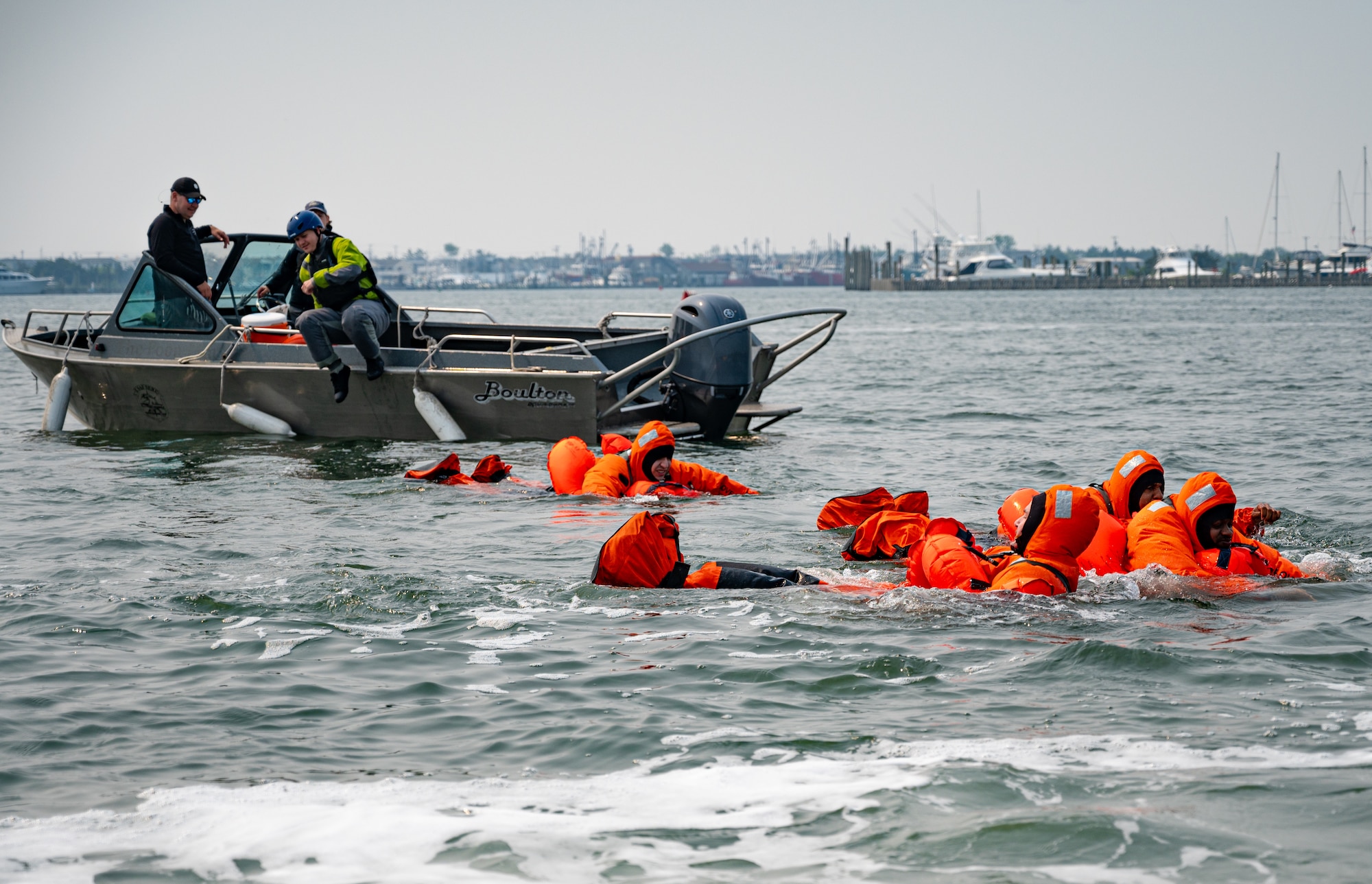 Royal Australian Air Force, Canadian Air Force, and U.S. Air Force aviators participate in a Survival, Evasion, Resistance and Escape water survival training course at Barnegat Light, N.J., June 6, 2023. SERE personnel from Joint Base McGuire-Dix-Lakehurst partnered with Coast Guard Air Station Atlantic City, N.J., to provide aircrew with realistic scenarios where flight crews must work together in order to survive a potential aircraft crash in the ocean. Exercises like these help build interoperability and standardized training capabilities throughout different service branches and our allied partners.