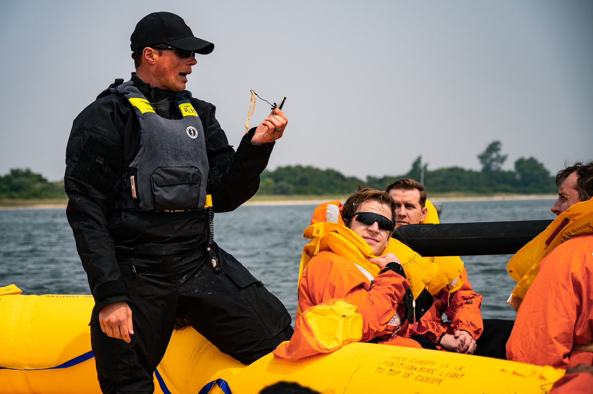 Royal Australian Air Force, Canadian Air Force, and U.S. Air Force aviators participate in a Survival, Evasion, Resistance and Escape water survival training course at Barnegat Light, N.J., June 6, 2023. SERE personnel from Joint Base McGuire-Dix-Lakehurst partnered with Coast Guard Air Station Atlantic City, N.J., to provide aircrew with realistic scenarios where flight crews must work together in order to survive a potential aircraft crash in the ocean. Exercises like these help build interoperability and standardized training capabilities throughout different service branches and our allied partners.