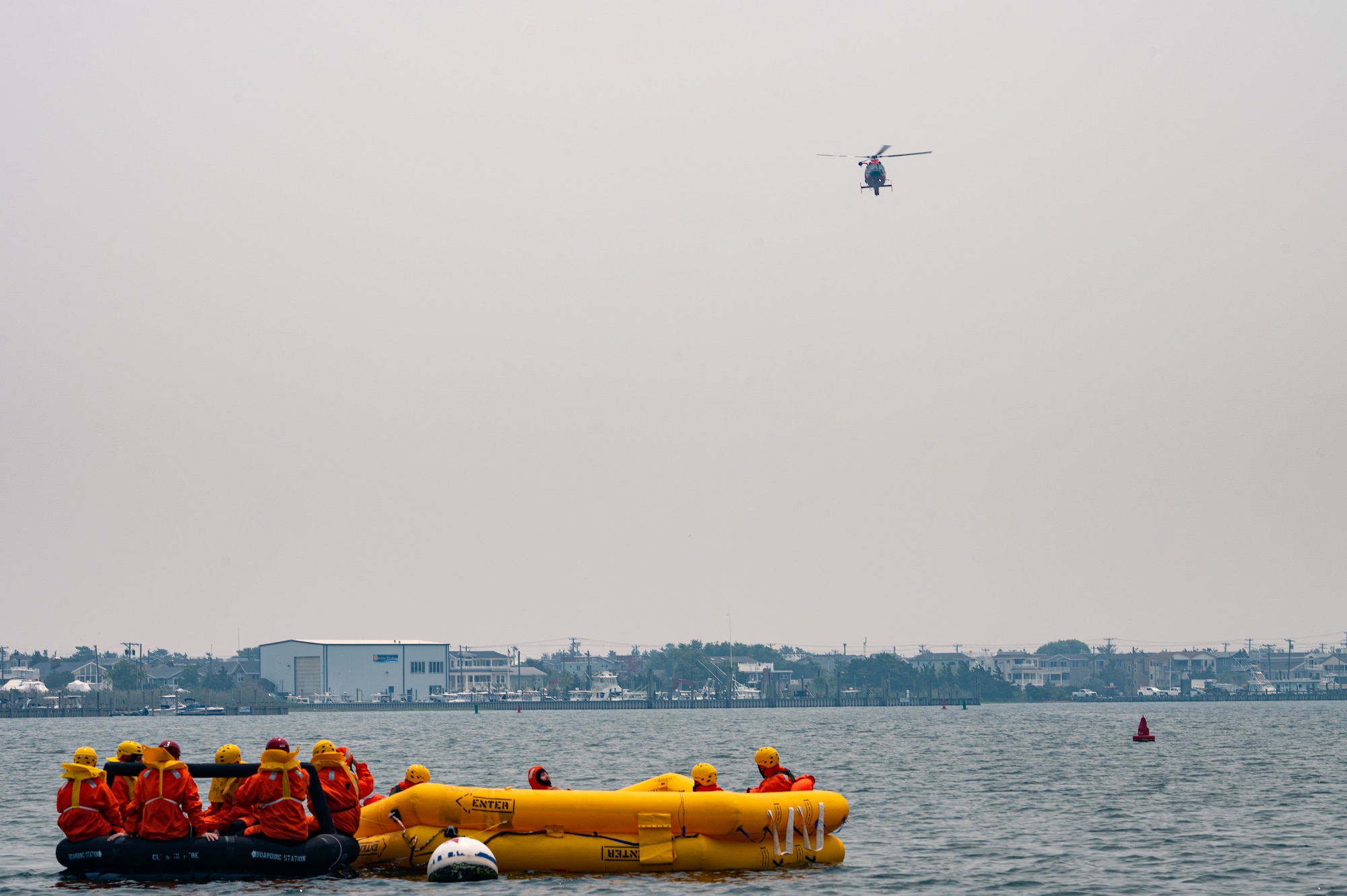 Royal Australian Air Force, Canadian Air Force, and U.S. Air Force aviators participate in a Survival, Evasion, Resistance and Escape water survival training course at Barnegat Light, N.J., June 6, 2023. SERE personnel from Joint Base McGuire-Dix-Lakehurst partnered with Coast Guard Air Station Atlantic City, N.J., to provide aircrew with realistic scenarios where flight crews must work together in order to survive a potential aircraft crash in the ocean. Exercises like these help build interoperability and standardized training capabilities throughout different service branches and our allied partners.