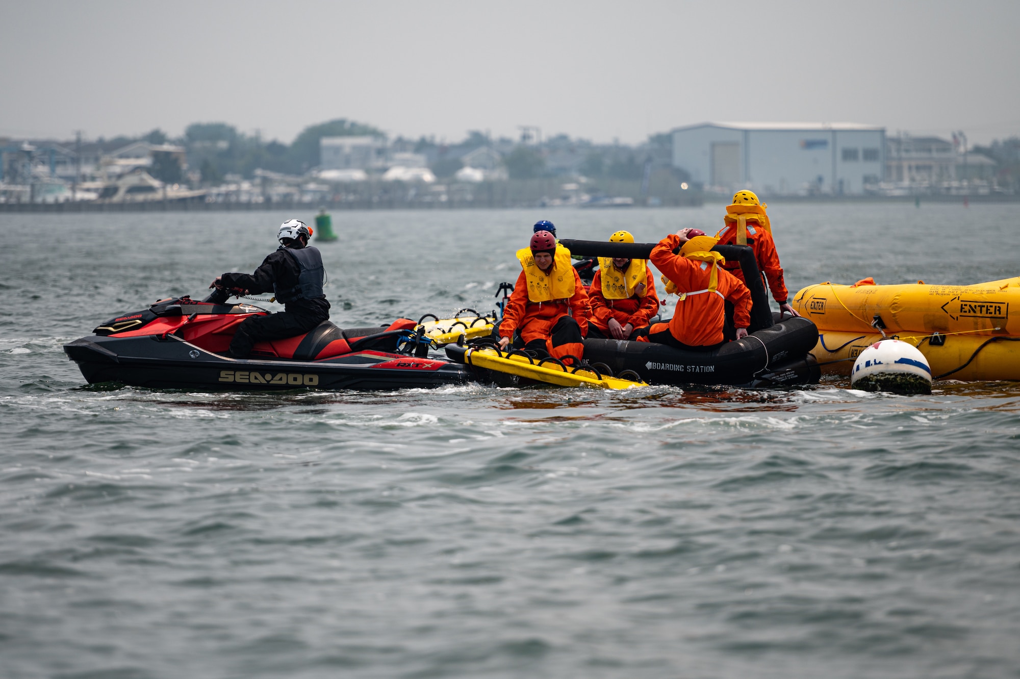 Royal Australian Air Force, Canadian Air Force, and U.S. Air Force aviators participate in a Survival, Evasion, Resistance and Escape water survival training course at Barnegat Light, N.J., June 6, 2023. SERE personnel from Joint Base McGuire-Dix-Lakehurst partnered with Coast Guard Air Station Atlantic City, N.J., to provide aircrew with realistic scenarios where flight crews must work together in order to survive a potential aircraft crash in the ocean. Exercises like these help build interoperability and standardized training capabilities throughout different service branches and our allied partners.