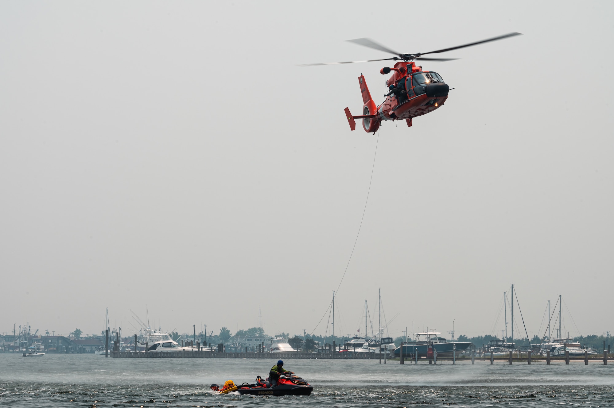Royal Australian Air Force, Canadian Air Force, and U.S. Air Force aviators participate in a Survival, Evasion, Resistance and Escape water survival training course at Barnegat Light, N.J., June 6, 2023. SERE personnel from Joint Base McGuire-Dix-Lakehurst partnered with Coast Guard Air Station Atlantic City, N.J., to provide aircrew with realistic scenarios where flight crews must work together in order to survive a potential aircraft crash in the ocean. Exercises like these help build interoperability and standardized training capabilities throughout different service branches and our allied partners.