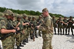 Sgt. Joshua Stiles, assigned to the Ohio National Guard’s Military Police Company, instructs members of the Serbian Armed Forces on non-lethal weapons tactics during Exercise Platinum Wolf 2018, June 15, 2018.