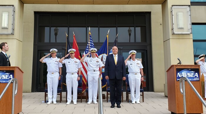 Mr. Jay Stefany, Acting  Assistant Secretary of the Navy for Research, Development, and Acquisition receives honors during the Change of Office ceremony for the AUKUS Integration and Acquisition (AUKUS I&A) Program Office at the Washington Navy Yard. During the ceremony, Capt. Lincoln Reifsteck (center) relieved Rear Adm. Dave Goggins (second from left) as the AUKUS I&A program manager. (Courtesy Photo)