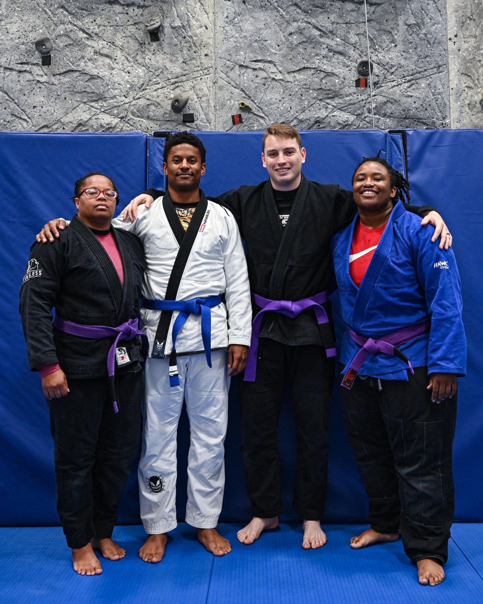 Task Force True North Brazilian Jiu Jitsu instructors pose for a photo in the base gym at Minot Air Force Base, North Dakota, June 15, 2023. The Task Force True North program is a free club open to any active duty Airman or spouse who wishes to learn Brazilian Jiu Jitsu. (U.S. Air Force photo by Senior Airman Caleb S. Kimmell)