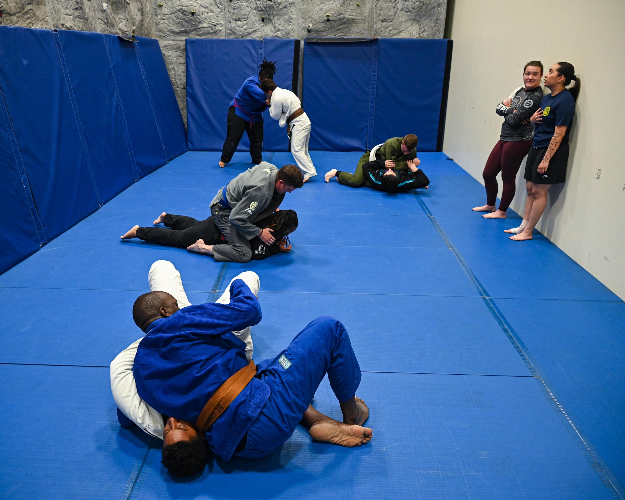 Team Minot Airmen grapple during a Brazilian Jiu Jitsu class in the base gym at Minot Air Force Base, North Dakota, June 15, 2023. Through Task Force True North’s Warrior program, 115 Team Minot Airmen come together three times a week, honing their skills and enjoying each other's company. (U.S. Air Force photo by Senior Airman Caleb S. Kimmell)