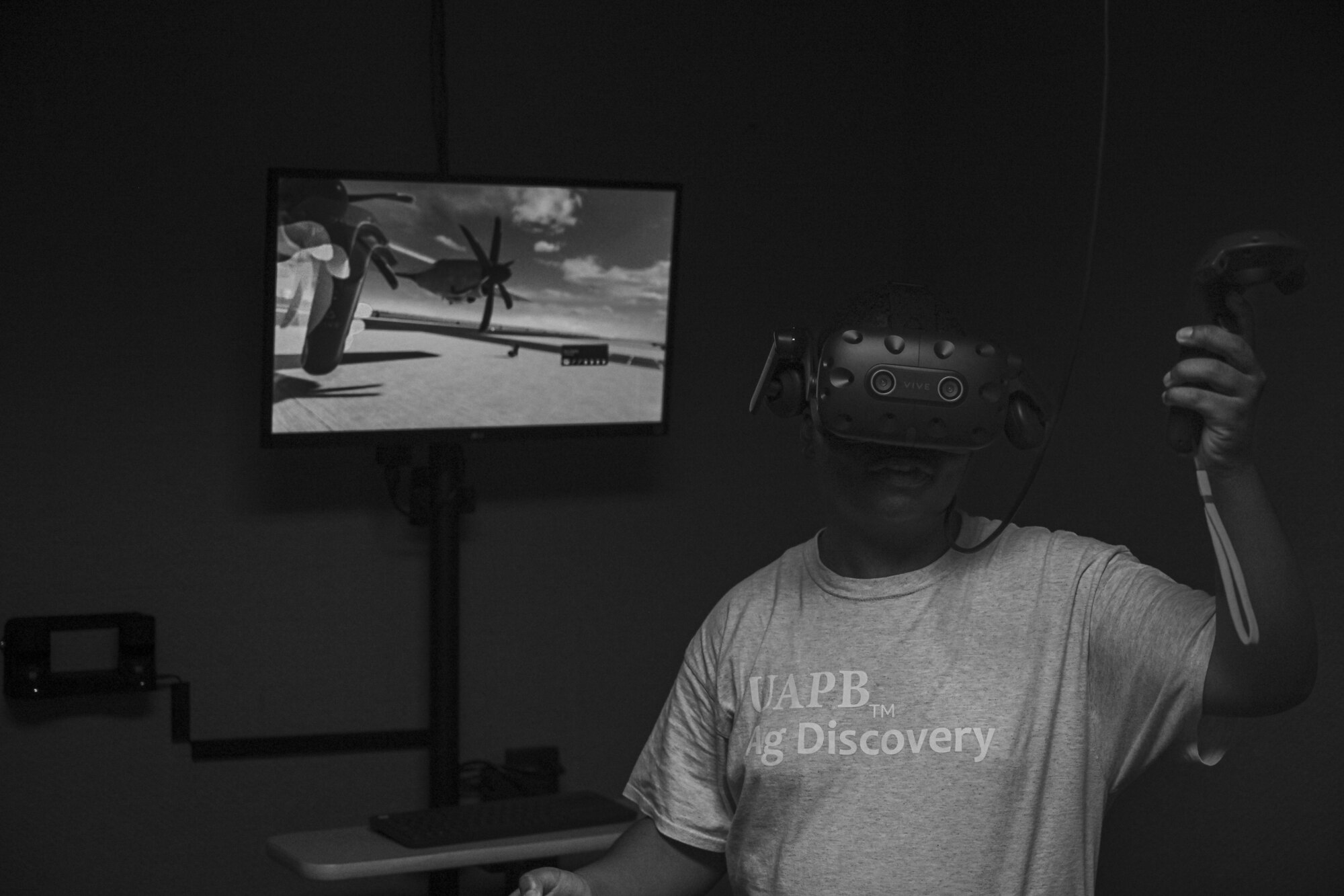 A teenager uses a virtual reality headset
